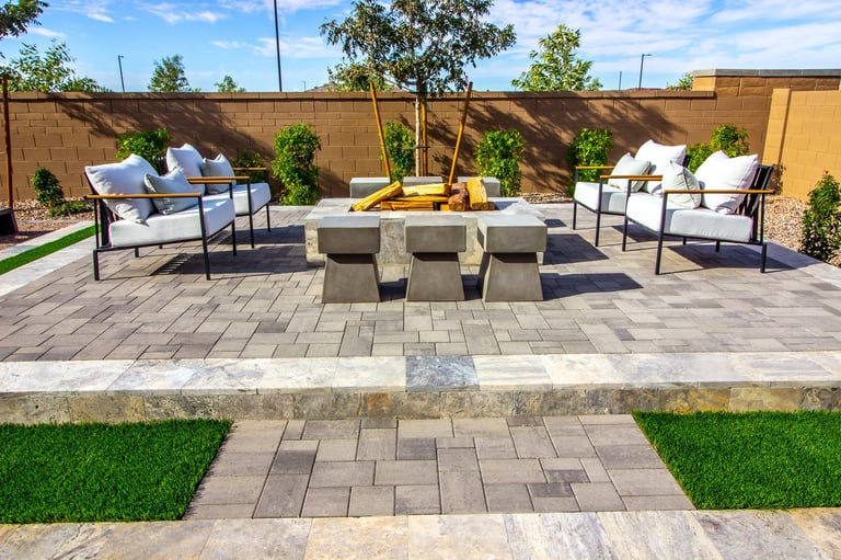Elegant paver patio with outdoor furniture and fire pit